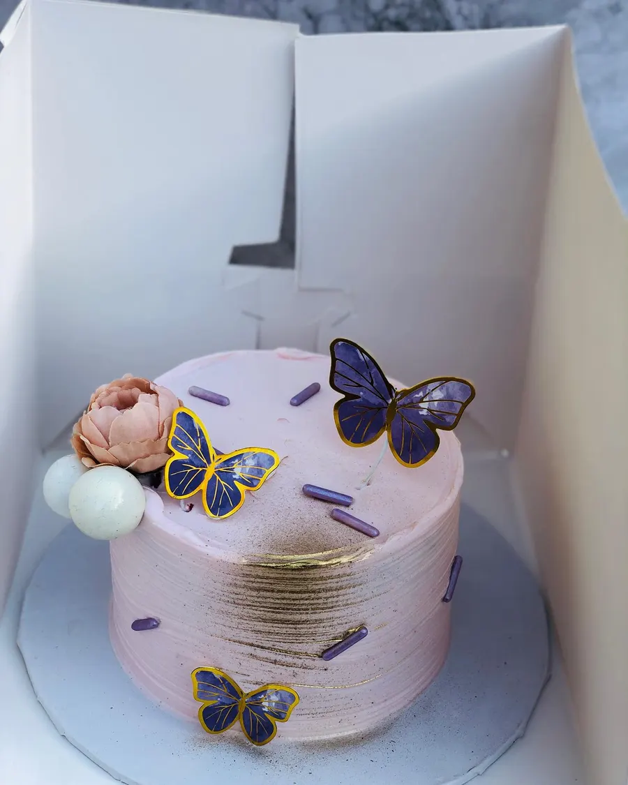 A pink butterfly cake from her first year baking in Aberdeen