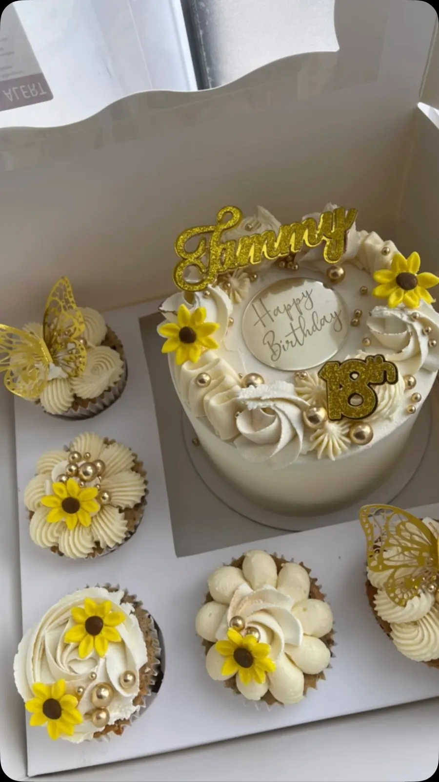 Yellow sunflower bento cake with butterfly cupcakes