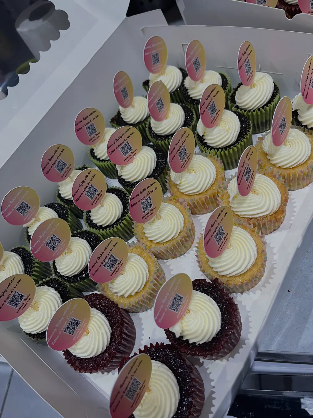 Eighty cupcakes with scan-to-follow toppers for an event