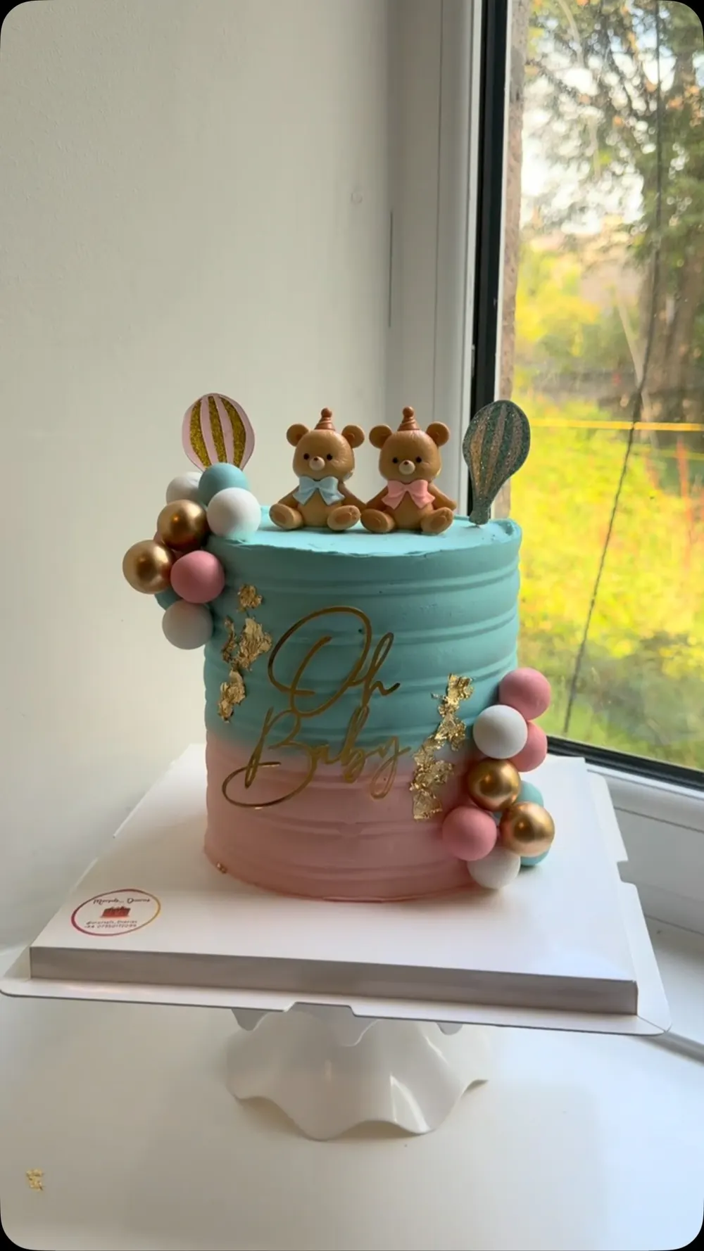 Teal and pink baby shower cake with teddy bears, gold leaf and an "Oh Baby" topper