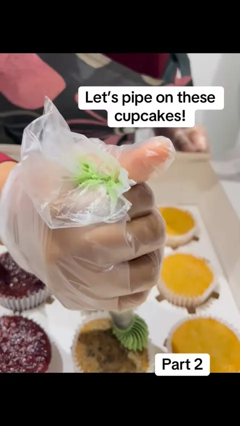 Piping buttercream onto cupcakes