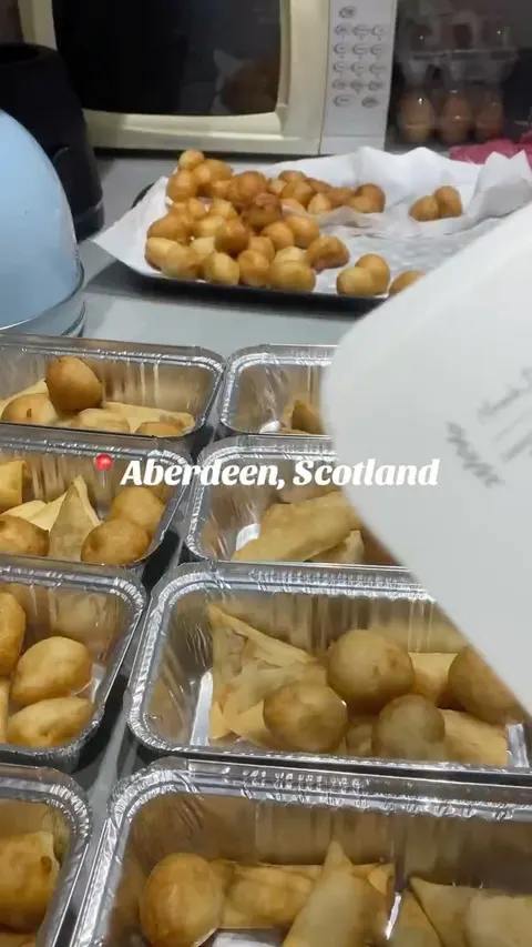 Trays of puff puff and spring rolls for an event