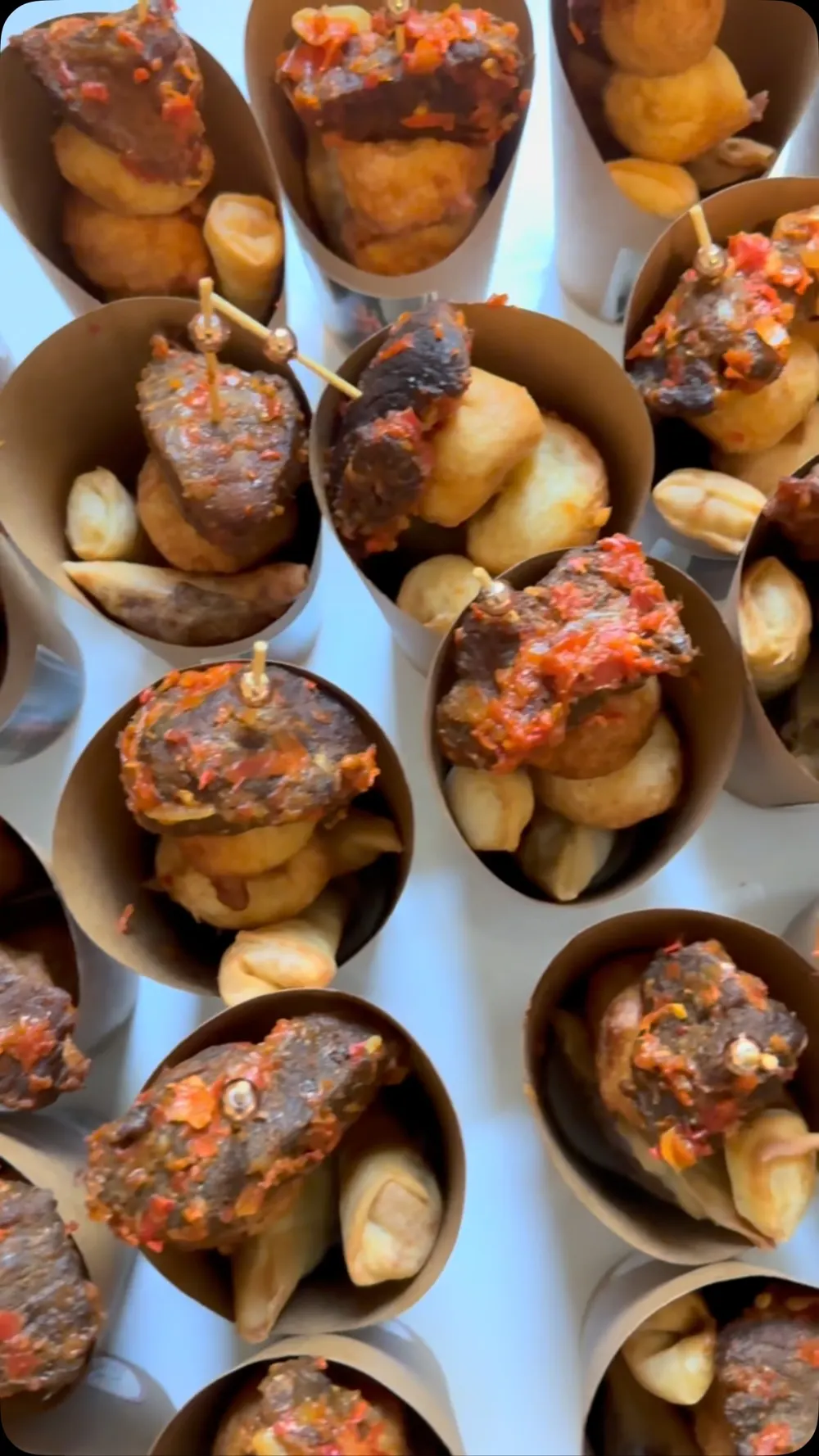 Small chops cups with peppered meat and puff puff